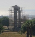 We drive by temple ruins with scaffolding